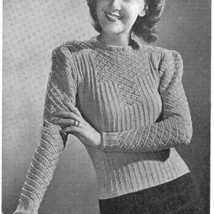 Model wearing a knitted sweater in a ribbed and lace pattern. Date: 1940 Model wearing a knitted sweater in a ribbed and lace pattern. Date: 1940