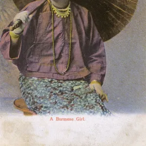 Myanmar - A Burmese girl with large open paper parasol