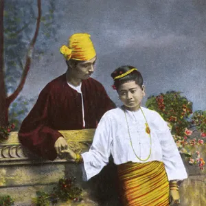 Myanmar - Couple holding hands over a low wall