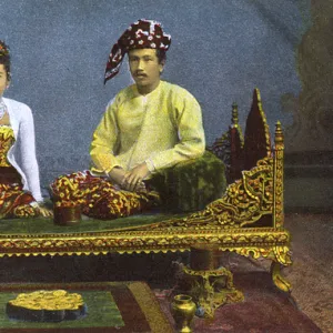 Myanmar - Couple posing on a divan