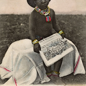 Native boy reading Cape Argus newspaper, South Africa