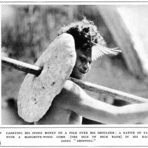 Native of Yap carrying stone money