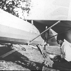 Natives repair tailplane (McCarthy Island)