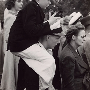 Naval cadet in a group of spectators