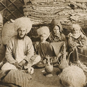 A Nomadic family group from Turkmenistan - inside their yurt