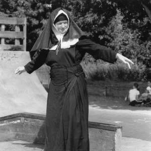 Nun on a skateboard