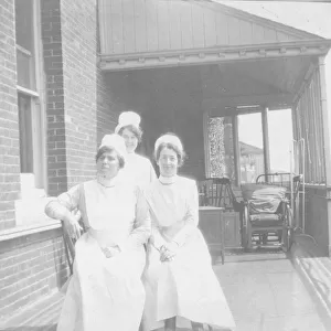 Three nurses on balcony, Bury St Edmunds Hospital