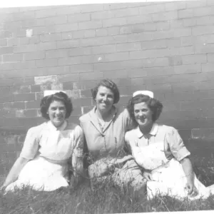 Two nurses and woman in mufti Two nurses and woman in mufti