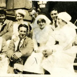 Four nurses and wounded servicemen on steps Four nurses and wounded servicemen on steps