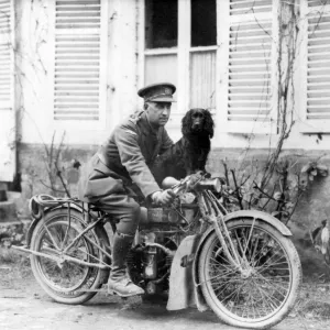 Officer of Tank Corps with dog and motorbike, France, WW1