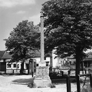 The old Market Cross on the village green at Billesden, Leicestershire, England
