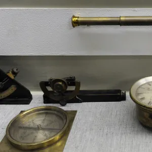 Old navigational instruments. Vintage telescope, compass, ho