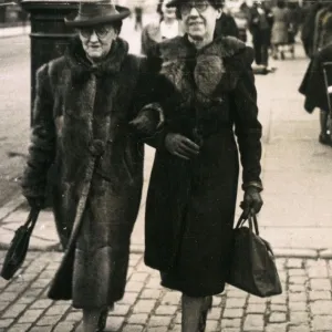 Old women walking togther down the street, 1920s