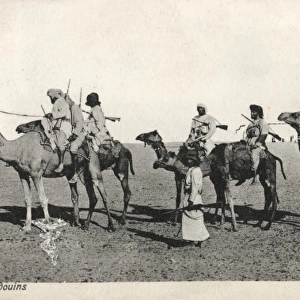 Omani Bedouins riding their camels, Oman