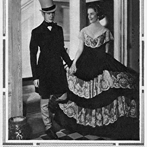 Party hosts Mr Bryan Guinness (1905-1992) and his wife (Diana Mitford) in her Mariette