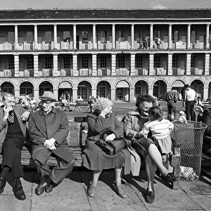 Pensioners and a child in the Piece Hall, Halifax, Yorkshire