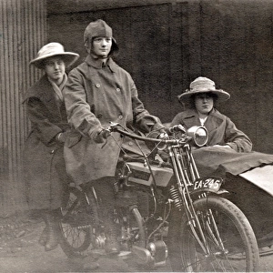 Three people on a 1920 Bradbury motorcycle & sidecar