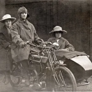 Three people on a 1920 Bradbury motorcycle & sidecar