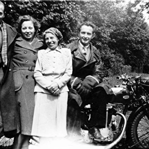 Four people with a 1936 BSA motorcycle