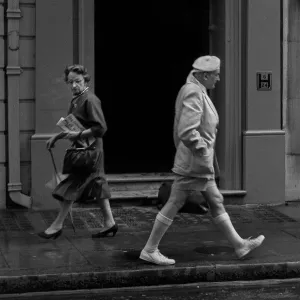 Two people pass each other in a London street