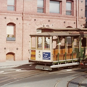 People standing by a cable cart track in San Francisco USA