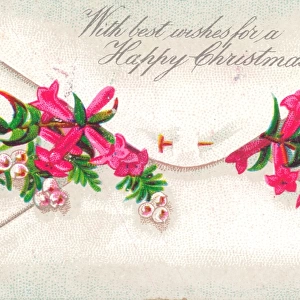 Pink flowers in an envelope on a Christmas card
