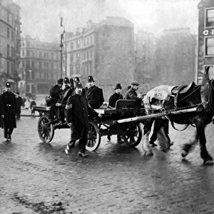 Police escorting a cart during Dundee riots, Scotland
