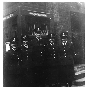 Five police officers outside Peel House, London