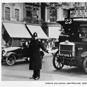 Policeman controlling traffic, Oxford Street, London