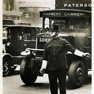 Policeman Helping Black Cat to Cross Road, London