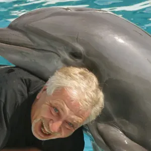 Portait of photographer Leandro A. Stanzani with Dolphin Portait of photographer Leandro A. Stanzani with Dolphin