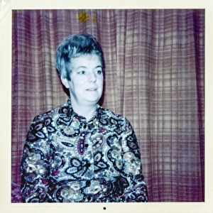 Portrait of a woman with typical 1960s hair style and blouse