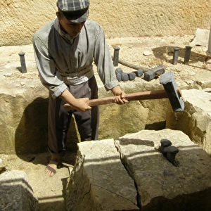 Quarryman splitting limestone block, Siggiewi, Malta