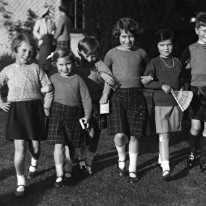 Queen Elizabeth II attends a birthday party as a girl