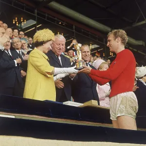 Queen Elizabeth II presents Bobby Moore with World Cup