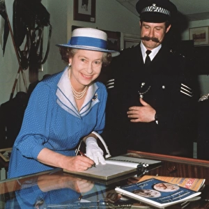 Queen Elizabeth II signing the visitors book