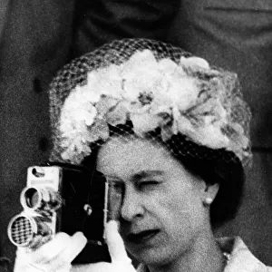 Queen Elizabeth II using a cine camera