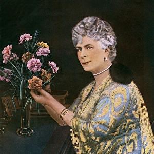 Queen Mary with a vase of flowers
