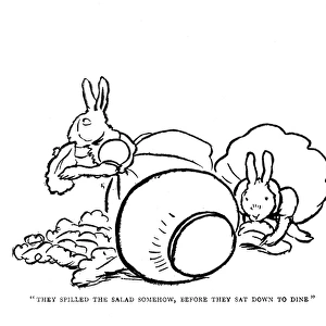 Two rabbits eating salad