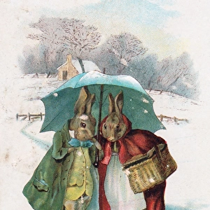 Two rabbits in the snow on a Christmas card
