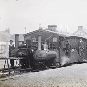 Railway station scene, locomotive