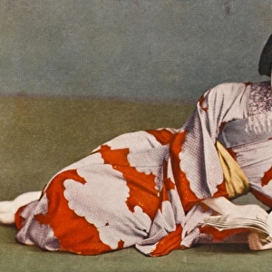 Reclining Japanese girl reading