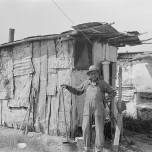 Resident of Tin Town on river side of levee, Caruthersville