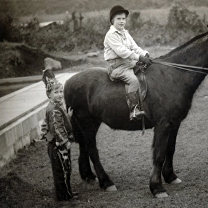 Ros Fraser in cowboy outfit, Goldie Fraser on horse