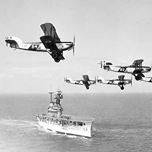 Royal Navy Aircraft Carrier and biplanes possibly 1920s