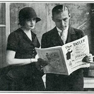 Rudolph Valentino reading The Tatler