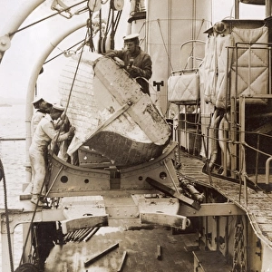 Sailors repairing a boat on a ship, WW1