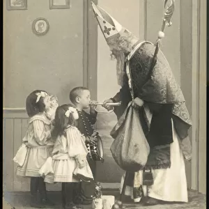 Saint Nicholas giving Christmas presents to children