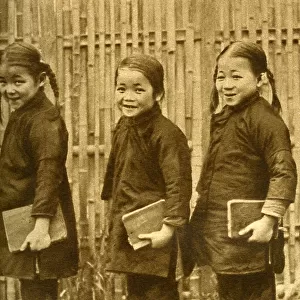 Four schoolgirls of Changsha with books, China, East Asia