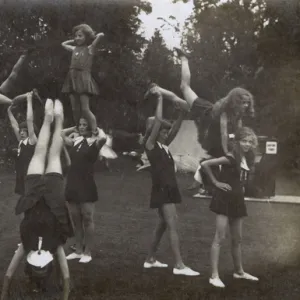 Schoolgirls practising gymnastics